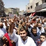 epa03287746 Jordanian protesters from the Islamic Action Front Party and other Jordanian opposition groups shouts slogans against the Jordanian Government during a march  to demand political reform after Friday prayers in Amman, Jordan, 29 June 2012.  EPA/JAMAL NASRALLAH