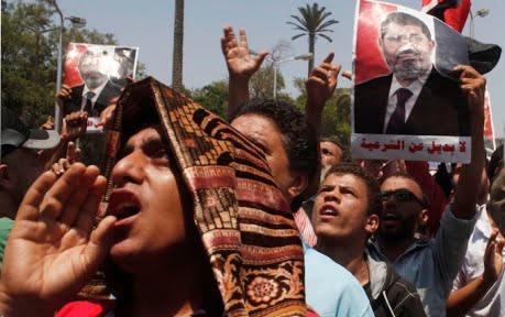 Protesters, who support former Egyptian President Mohamed Mursi, march near Cairo University in Cairo