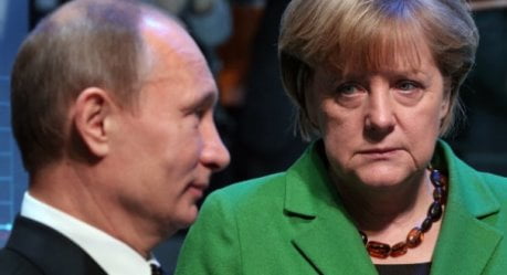 German Chancellor Angela Merkel and Russian President Vladimir Putin chat as they toured the Hanover industrial fair on April 8, 2013 in Hanover, central Germany. German Chancellor Angela Merkel and Russian President Vladimir Putin opened the fair which is running from April 8 to 12, 2013 and which will present a cross section of key industrial technologies. AFP PHOTO / RONNY HARTMANN        (Photo credit should read RONNY HARTMANN/AFP/Getty Images)