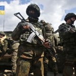 Ukrainian army troops receive munitions on the outskirts of Izyum