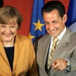 French Interior Minister and UMP party President Sarkozy poses with German CDU President Merkel in Paris