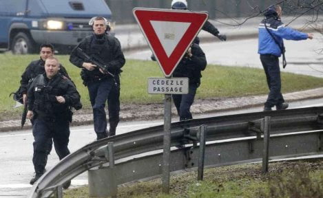 Members of the French intervention gendarme forces arrive at the scene of a hostage taking at an industrial zone in Dammartin-en-Goele, northeast of Paris